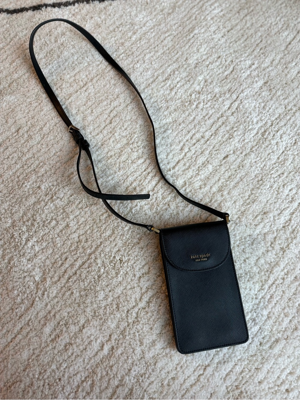 kate spade black leather crossbody phone pouch with gold logo